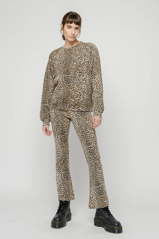 Photo of a model wearing the Crop Leggings in Brown Leopard