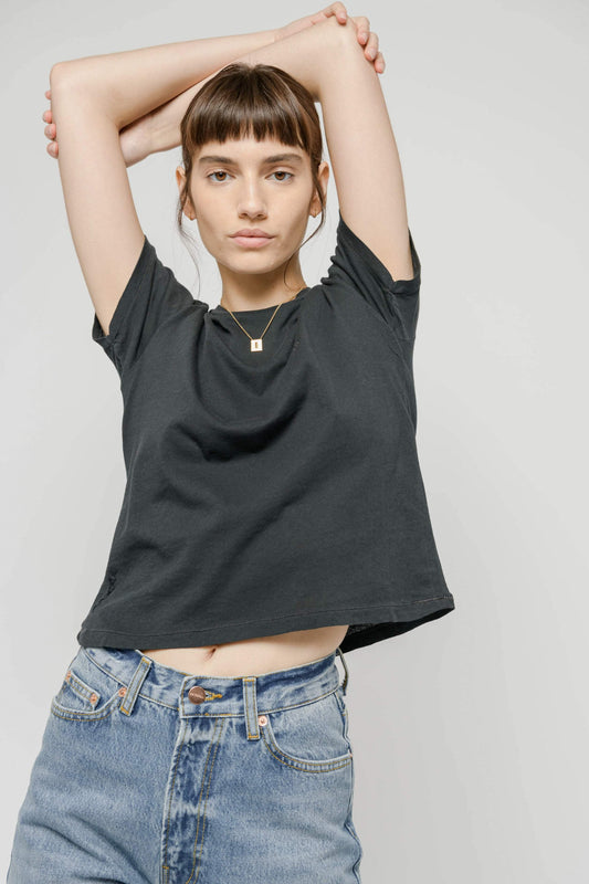 Photo of a model wearing the Cropped Tee in Black